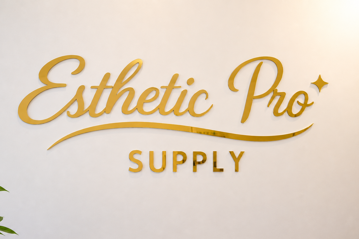Gold 'Esthetic Pro Supply' logo on a white wall with a plant and desk in the foreground.