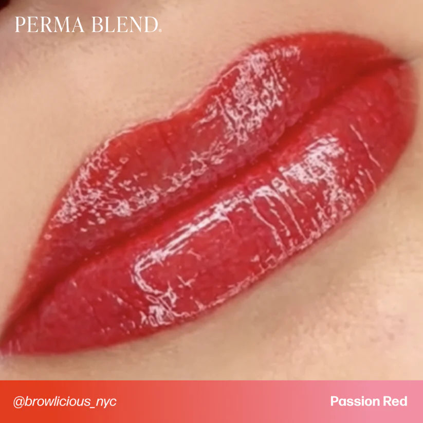 Close-up of red lipstick on lips with 'Perma Blend' branding.